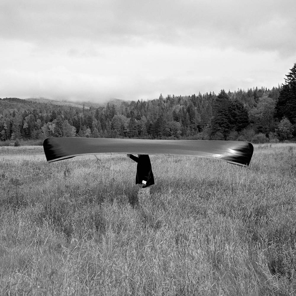 Man with Canoe on Head, Saranac, New York 1994
